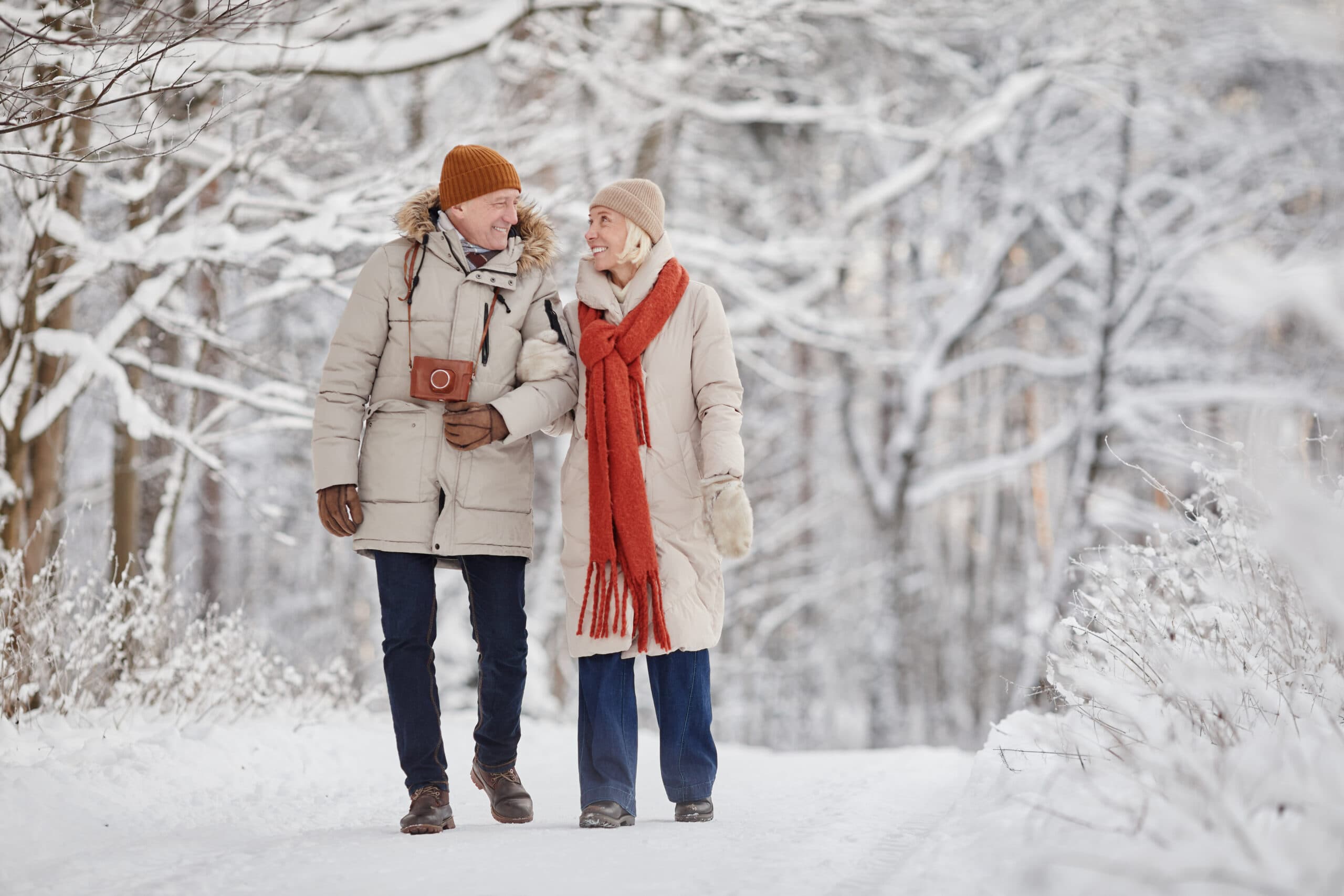 a couple walking outside in the snow