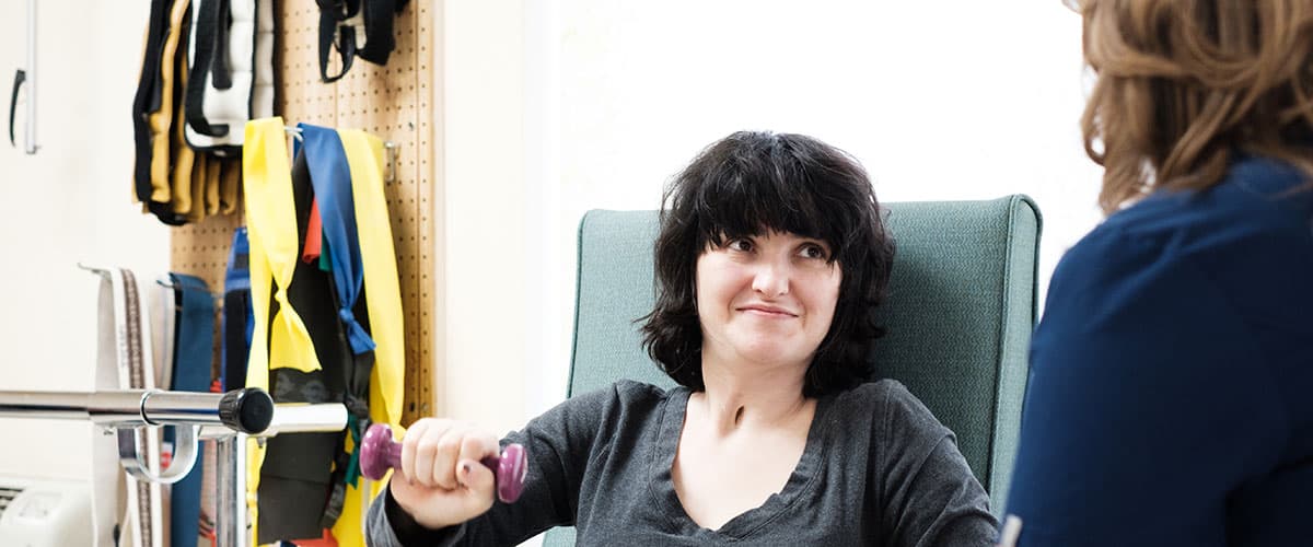 Smiling woman in portrait photo at Embassy Oaks healthcare facility