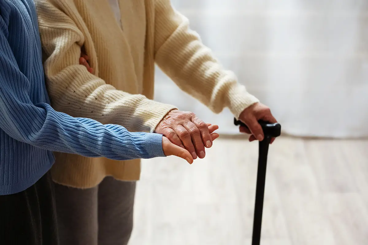 Counselor providing emotional support to a senior at an adult daycare program