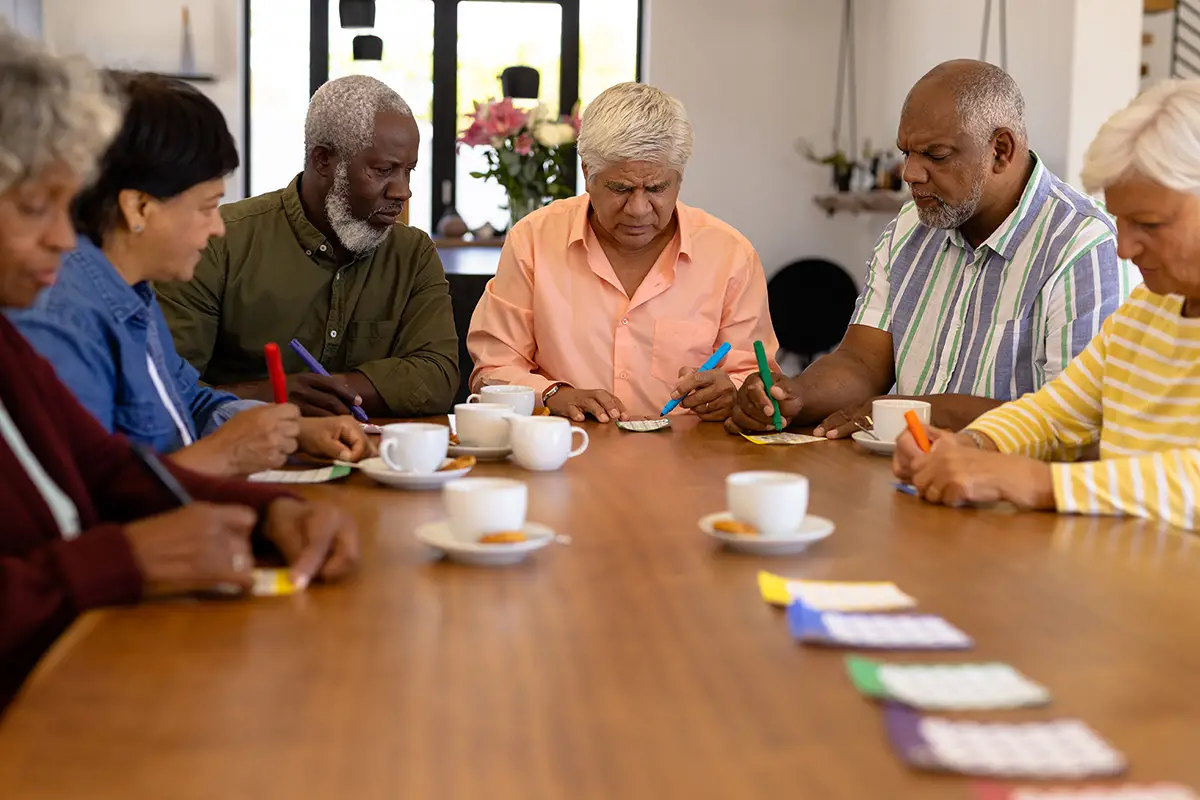 Seniors enjoying a social meal together at an adult daycare program