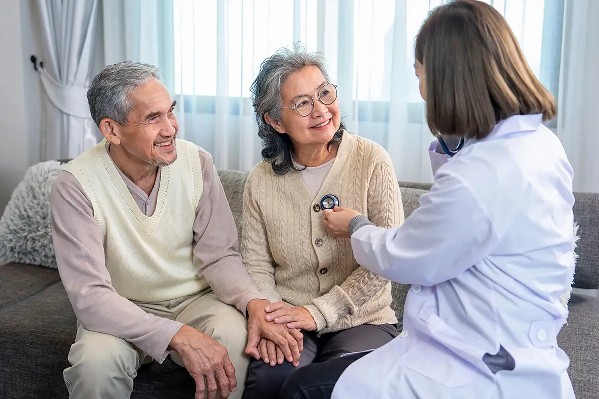 Caregiver interacting warmly with a senior, showing what makes Embassy Healthcare different