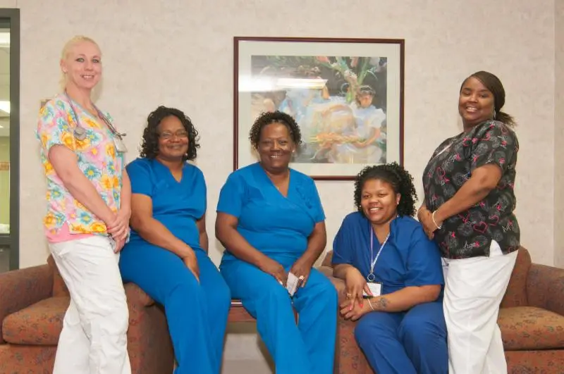 Embassy Healthcare team members and family celebrating core values together