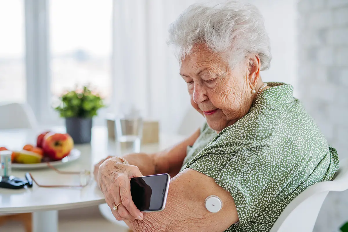 Elderly woman enjoying a healthy meal as part of diabetes care that enhances quality of life