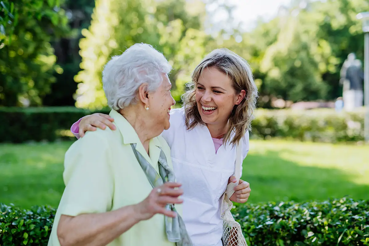 Staff member reviewing qualifications with a family visiting a healthcare facility