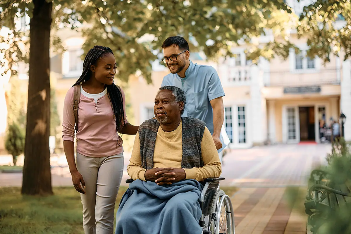 Family members taking a tour of an Embassy Healthcare facility