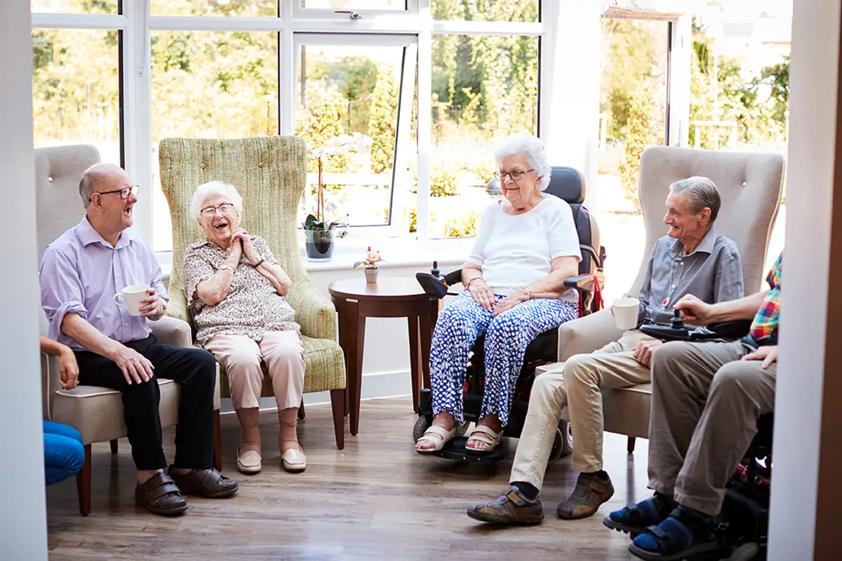 Seniors socializing in a comfortable independent living community setting