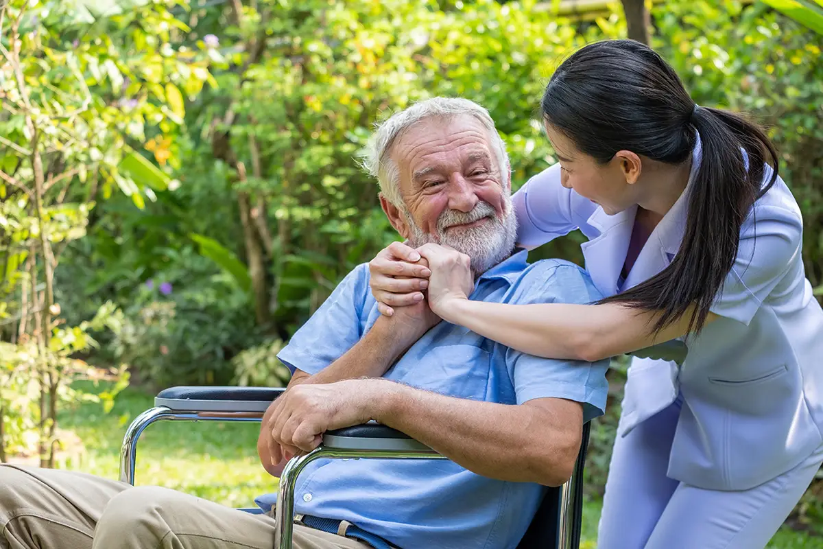 Caregiver providing emotional and psychological support to an elderly long-term care resident