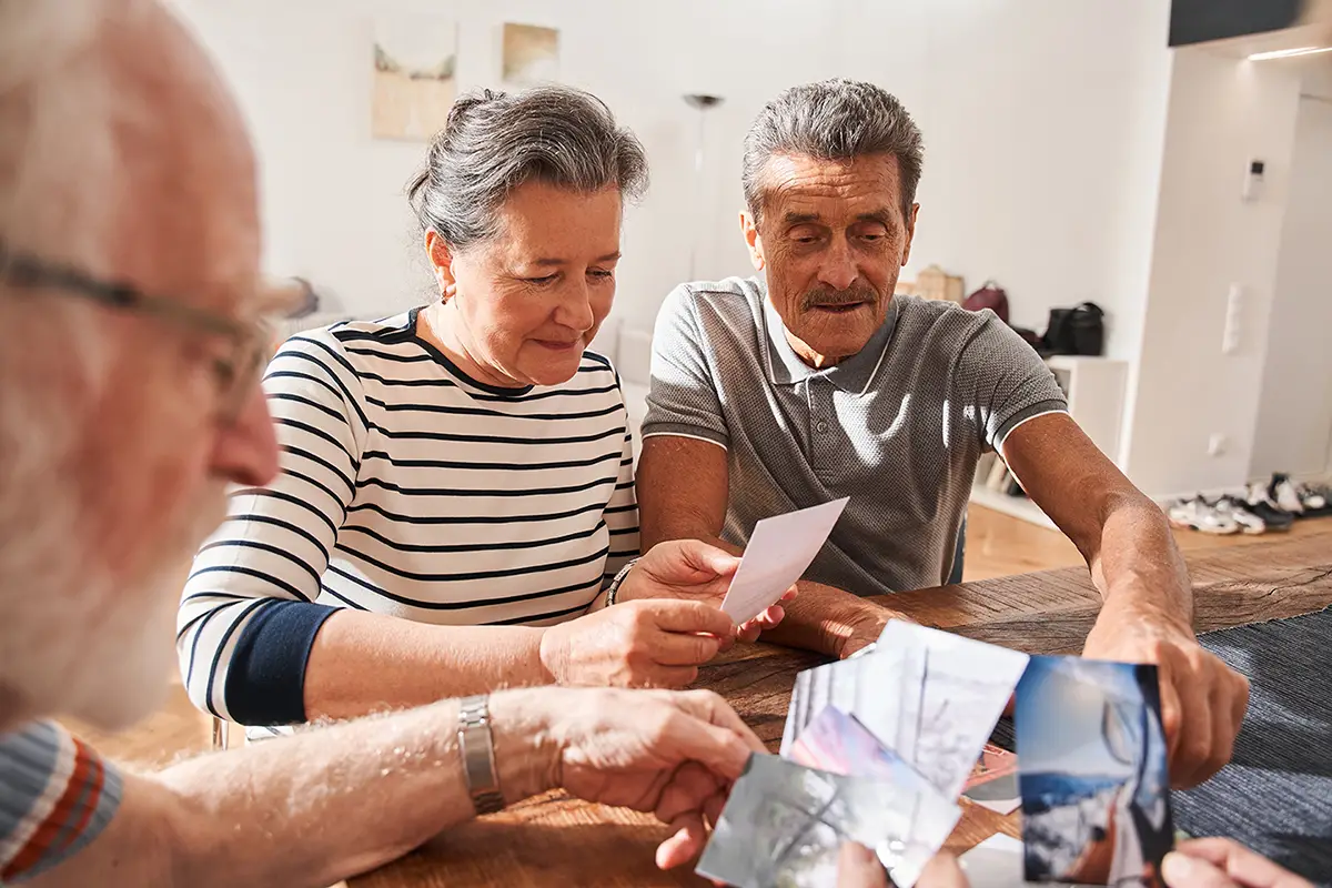 Family members receiving support and education about memory care from a staff member