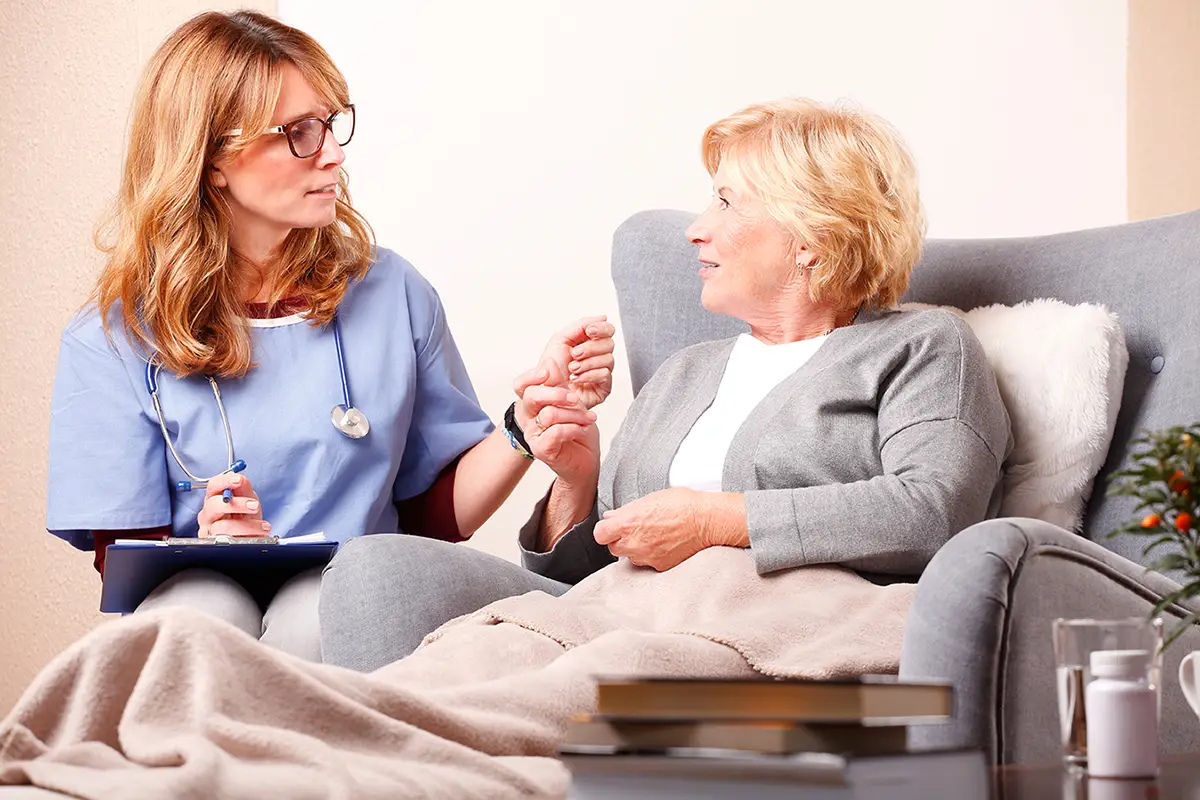 Healthcare provider explaining pulmonary care and respiratory support to a patient