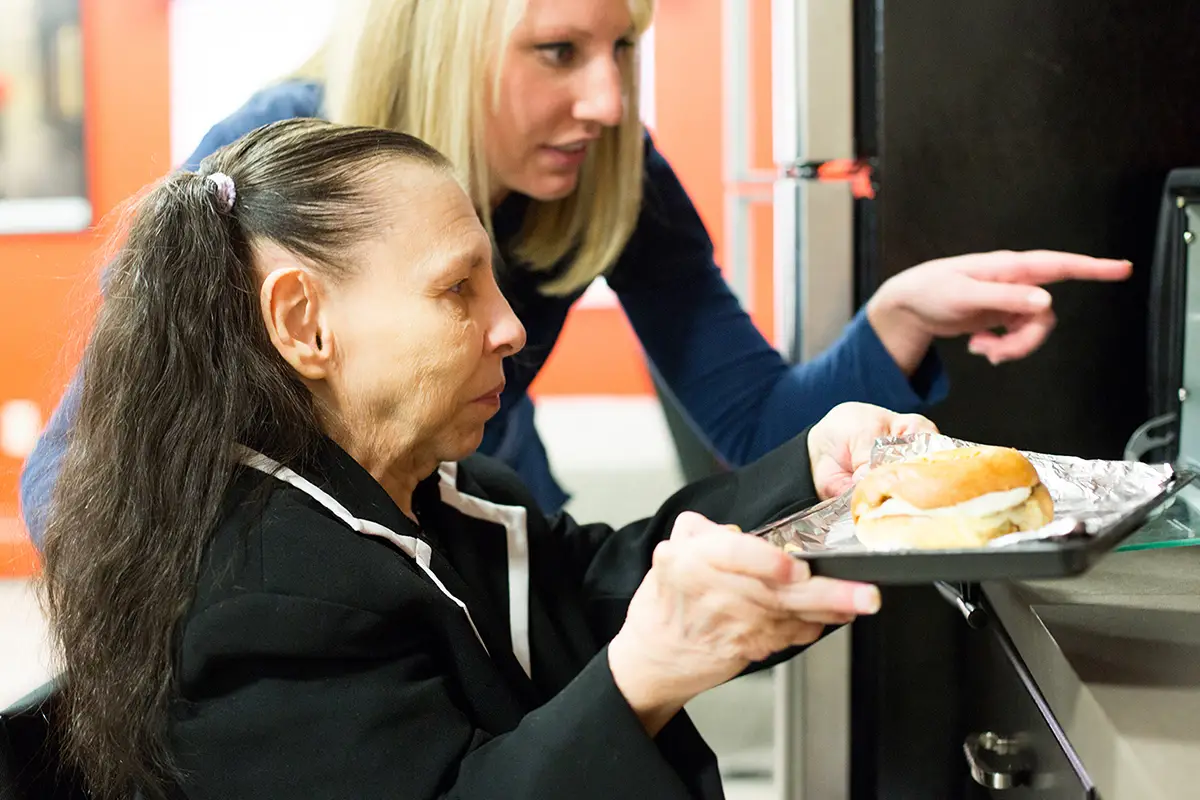 Occupational therapist working with a patient on rehabilitation exercises