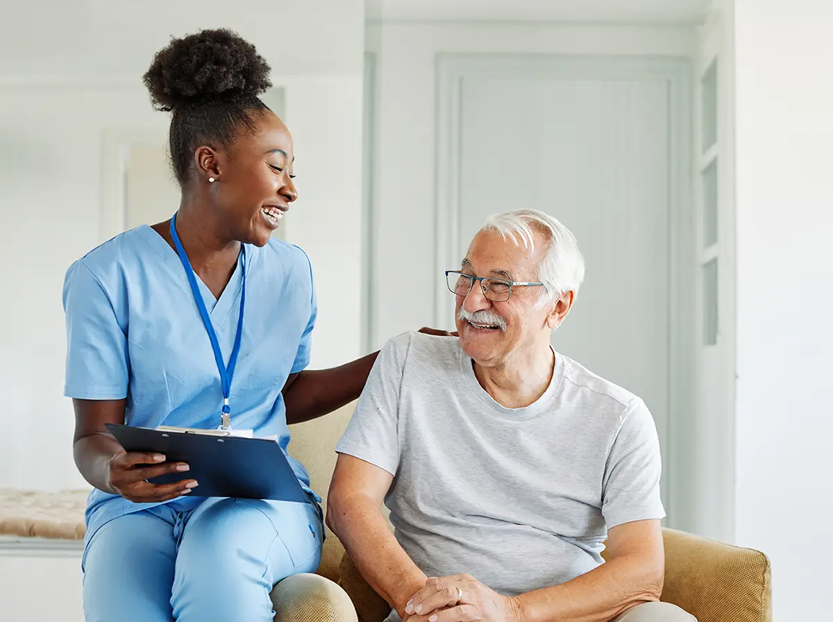 Healthcare professional providing compassionate renal care to a patient