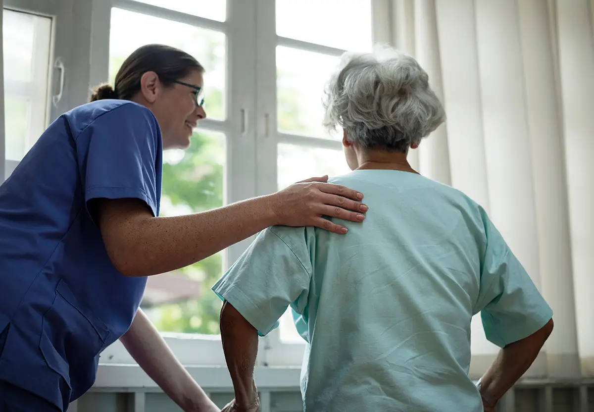 Nurse performing wound care treatment on a patient