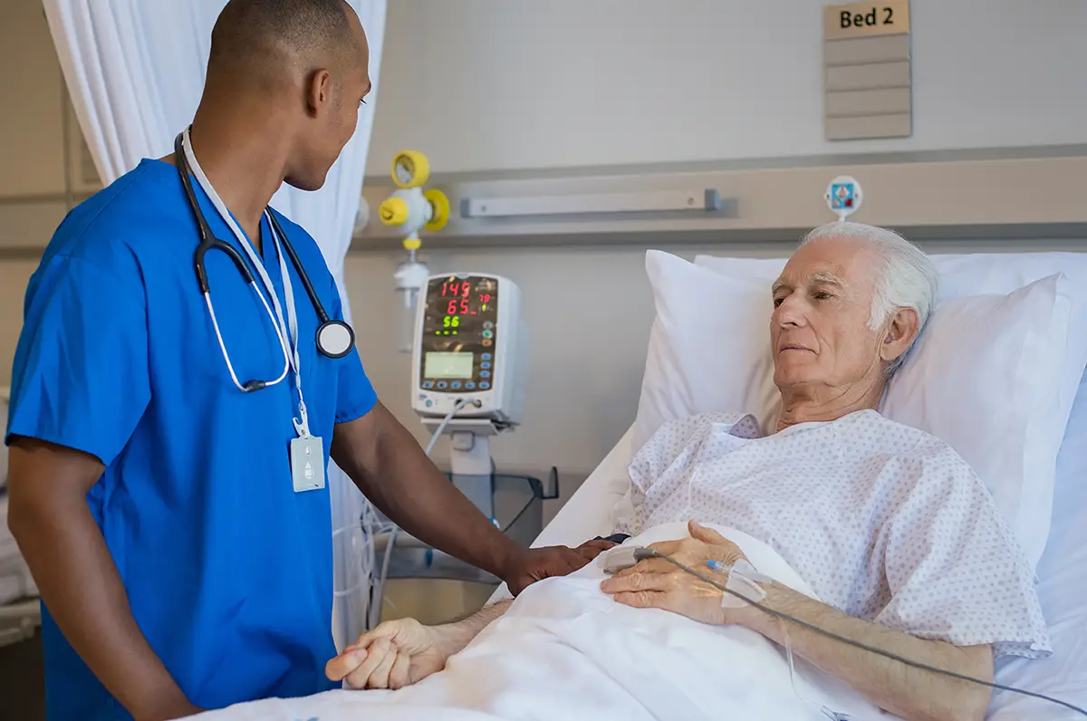 Healthcare professional conducting a wound assessment on an elderly patient