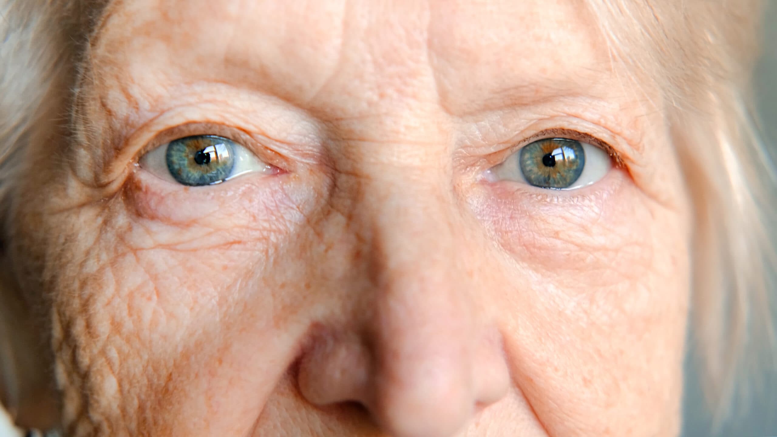 blue eyes of an elderly woman